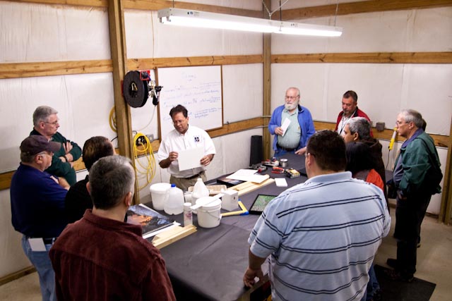 Demonstrating wet mounting canvas on gatorboard.